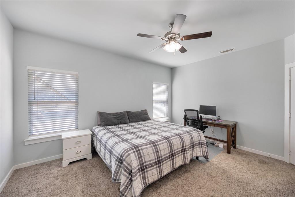 12616 Metz Road Sanger, TX 76266 - Photo 13 of 26 a bedroom with a bed and a window