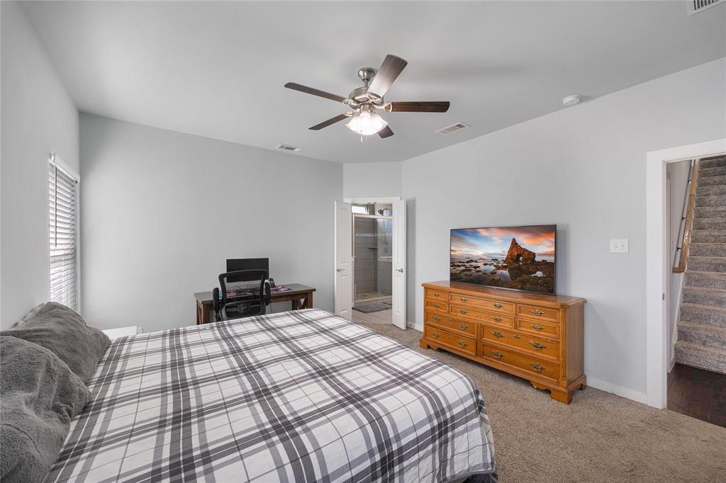 12616 Metz Road Sanger, TX 76266 - Photo 14 of 26 a bedroom with a bed and a flat screen tv