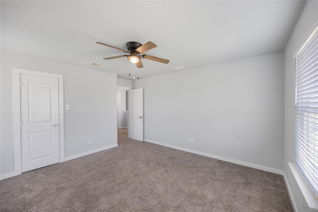 12616 Metz Road Sanger, TX 76266 - Photo 20 of 26 a view of room with a ceiling fan and window