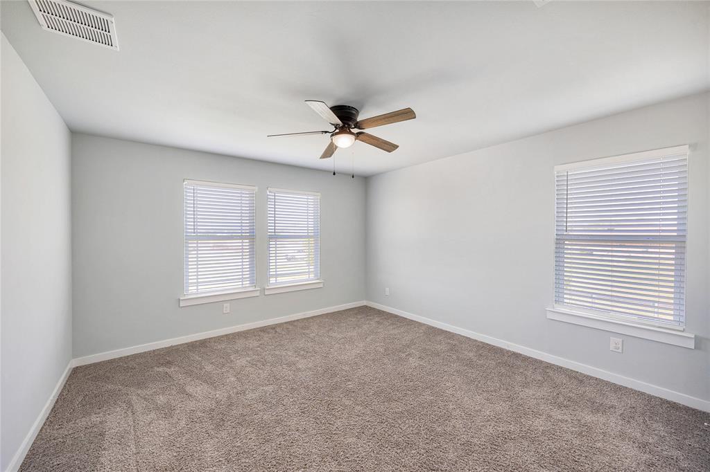 12616 Metz Road Sanger, TX 76266 - Photo 21 of 26 wooden floor in an empty room with a window