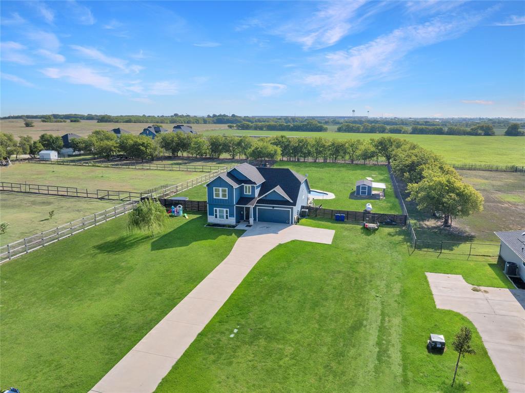 12616 Metz Road Sanger, TX 76266 - Photo 3 of 26 an aerial view of a golf course with a big yard