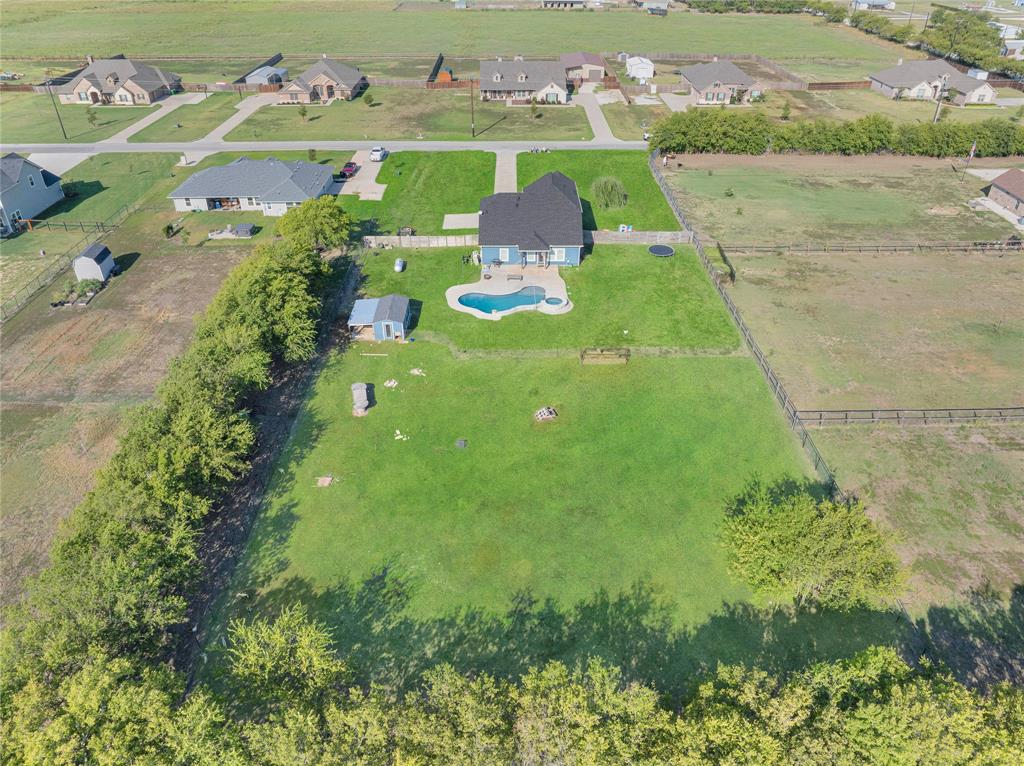 12616 Metz Road Sanger, TX 76266 - Photo 4 of 26 a view of a lake with a houses