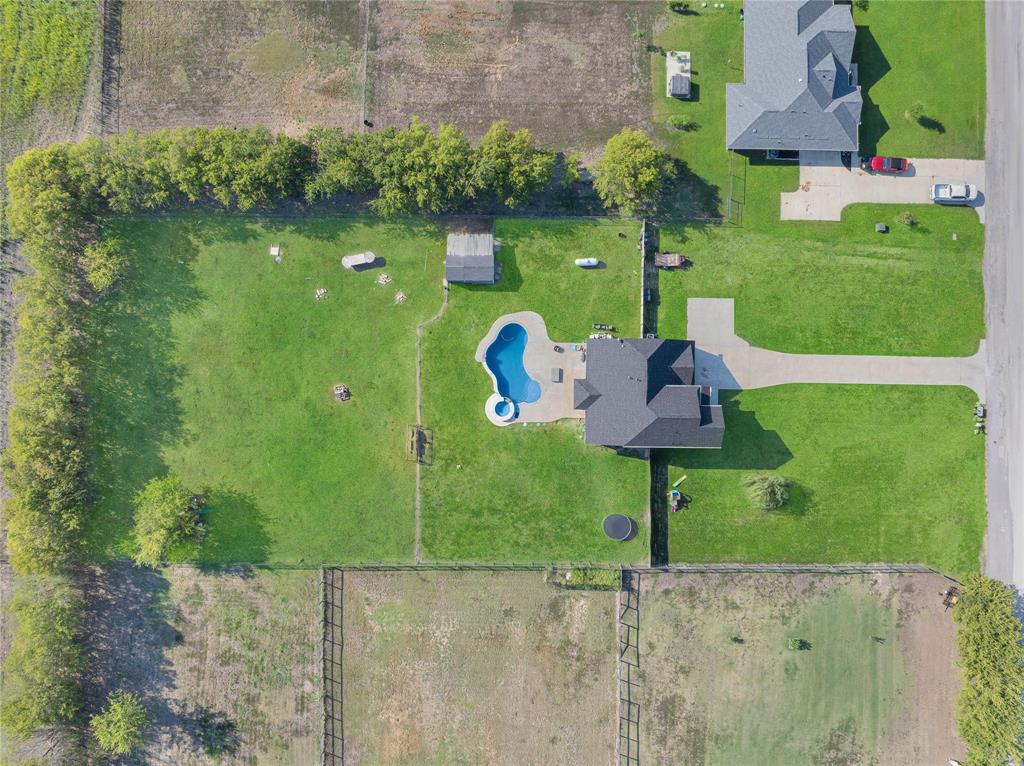 12616 Metz Road Sanger, TX 76266 - Photo 5 of 26 a view of a table and chairs in the garden