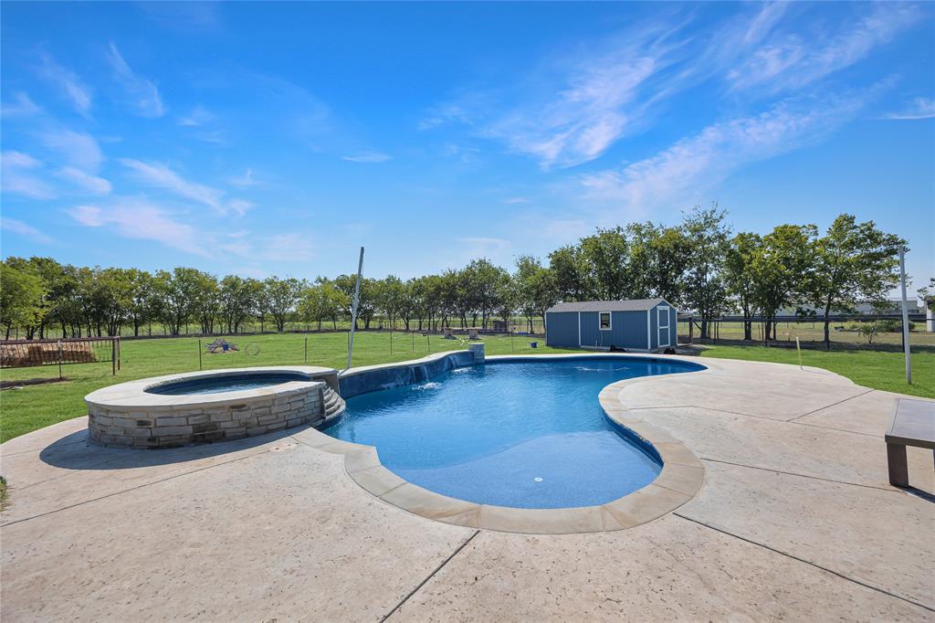 12616 Metz Road Sanger, TX 76266 - Photo 6 of 26 a view of a swimming pool with a patio