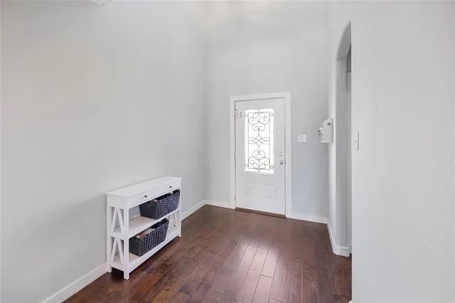 a room with a hardwood and closet