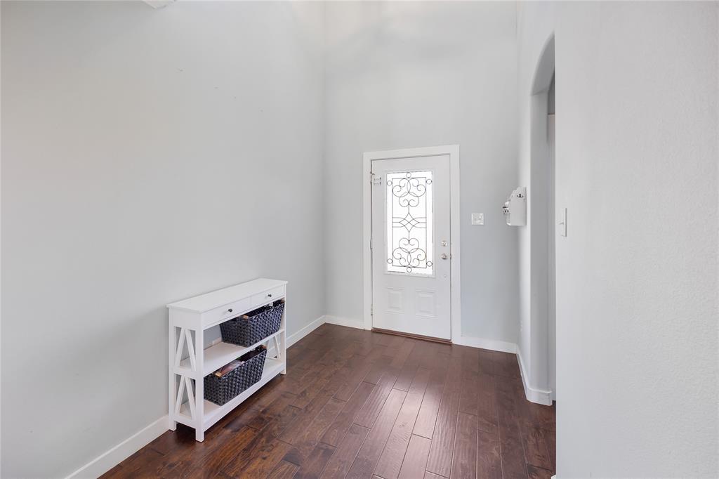 12616 Metz Road Sanger, TX 76266 - Photo 7 of 26 a room with a hardwood and closet