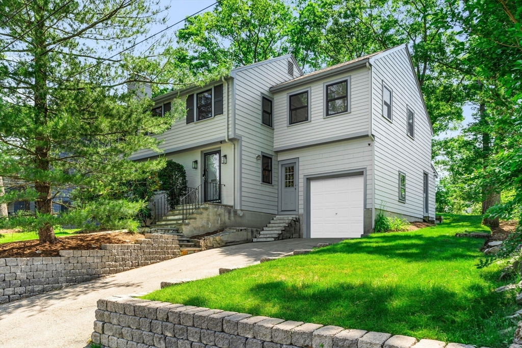 134 Walnut Hill Road Newton, MA 02461 - Photo 3 of 39 a front view of house with yard and green space
