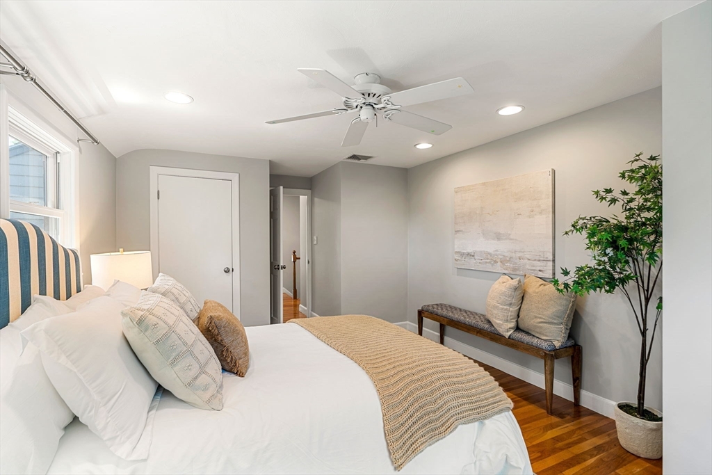 134 Walnut Hill Road Newton, MA 02461 - Photo 38 of 39 a bedroom with a bed and a potted plant