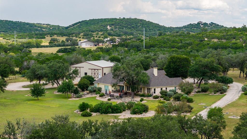 1320 Pass Creek Road East Center Point, TX 78010 - Photo 1 of 51 an aerial view of a house with yard and green space
