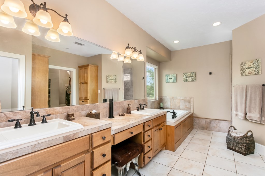 1320 Pass Creek Road East Center Point, TX 78010 - Photo 12 of 51 a large bathroom with a double vanity sink mirror and