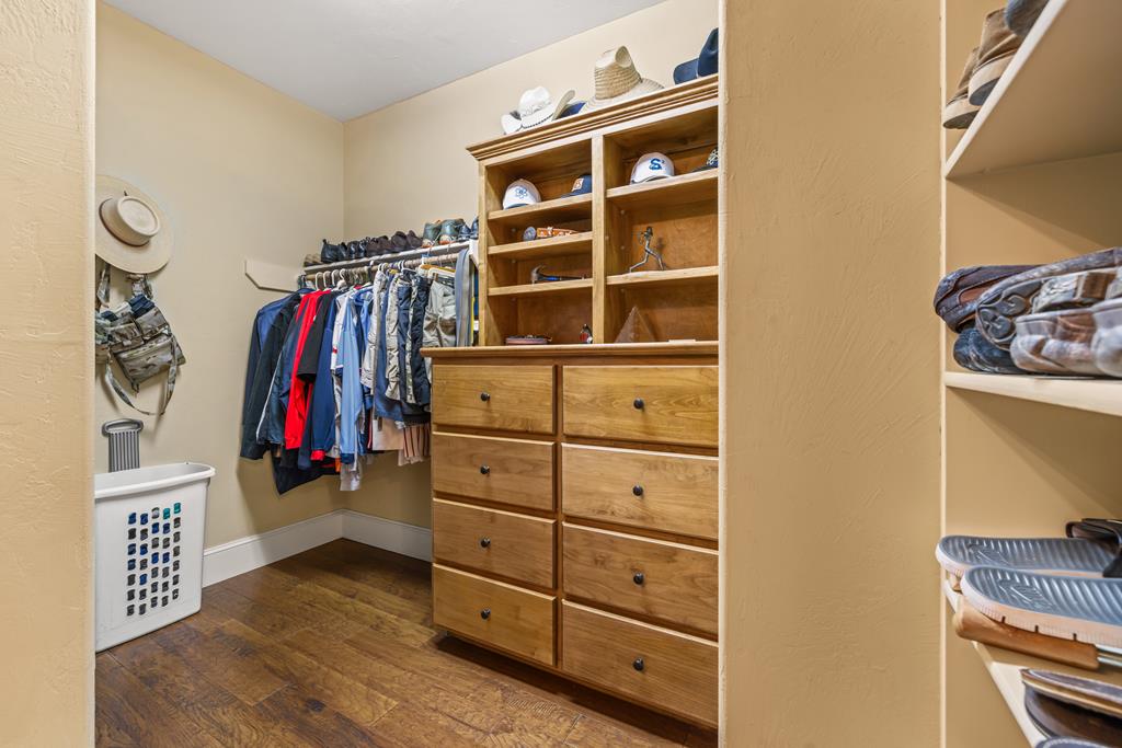 1320 Pass Creek Road East Center Point, TX 78010 - Photo 16 of 51 a view of walk in closet with clothes and shoes