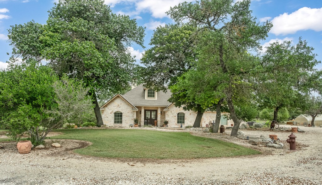 1320 Pass Creek Road East Center Point, TX 78010 - Photo 28 of 51 a view of a white house with a yard