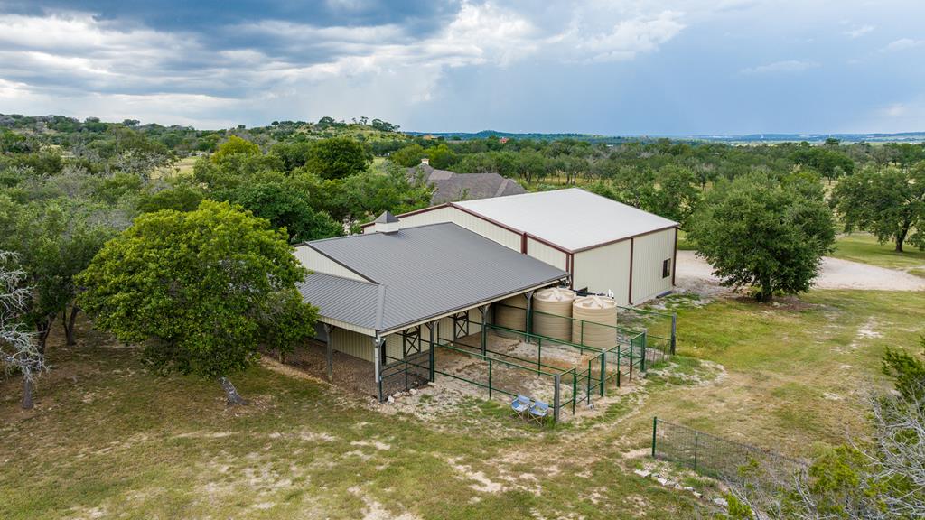 1320 Pass Creek Road East Center Point, TX 78010 - Photo 30 of 51 a view of a house with pool and a yard