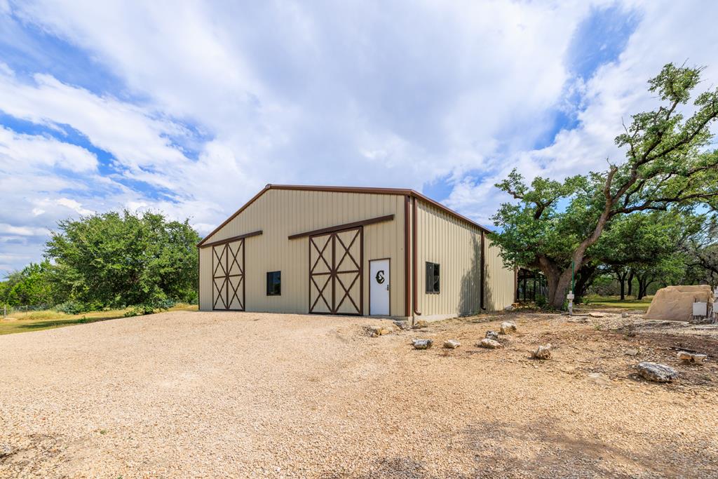 1320 Pass Creek Road East Center Point, TX 78010 - Photo 42 of 51 a front view of a house with a yard