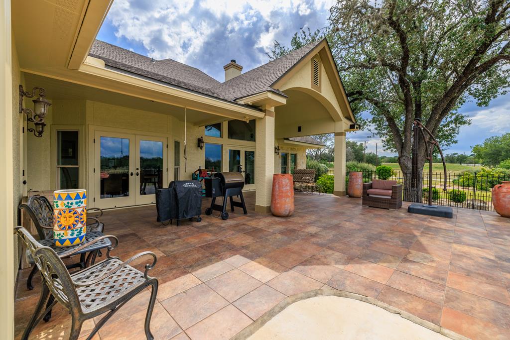 1320 Pass Creek Road East Center Point, TX 78010 - Photo 49 of 51 a view of a house with backyard porch and sitting area