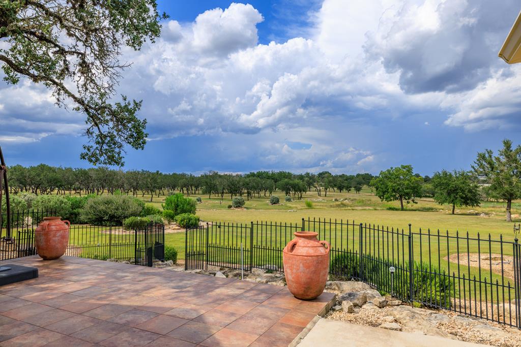 1320 Pass Creek Road East Center Point, TX 78010 - Photo 50 of 51 a view of a lake with a garden