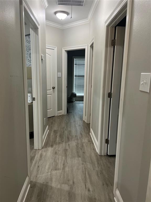 5270 Quad J Road Shreveport, LA 71107 - Photo 16 of 18 a view of a hallway with wooden floor and closet area