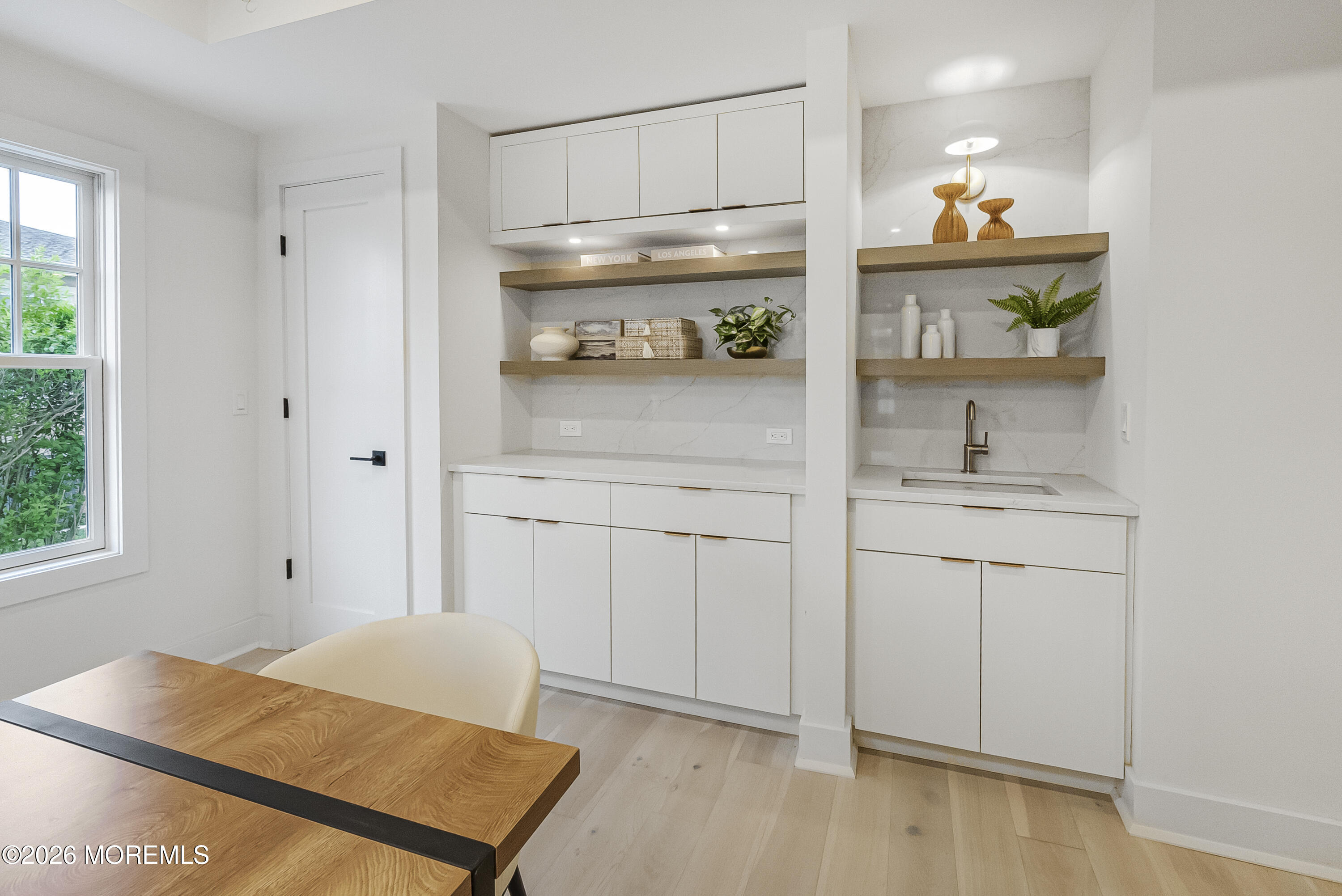 205 Edgemont Drive, Unit 1 Allenhurst, NJ 07711 - Photo 11 of 24 a kitchen with white cabinets and window