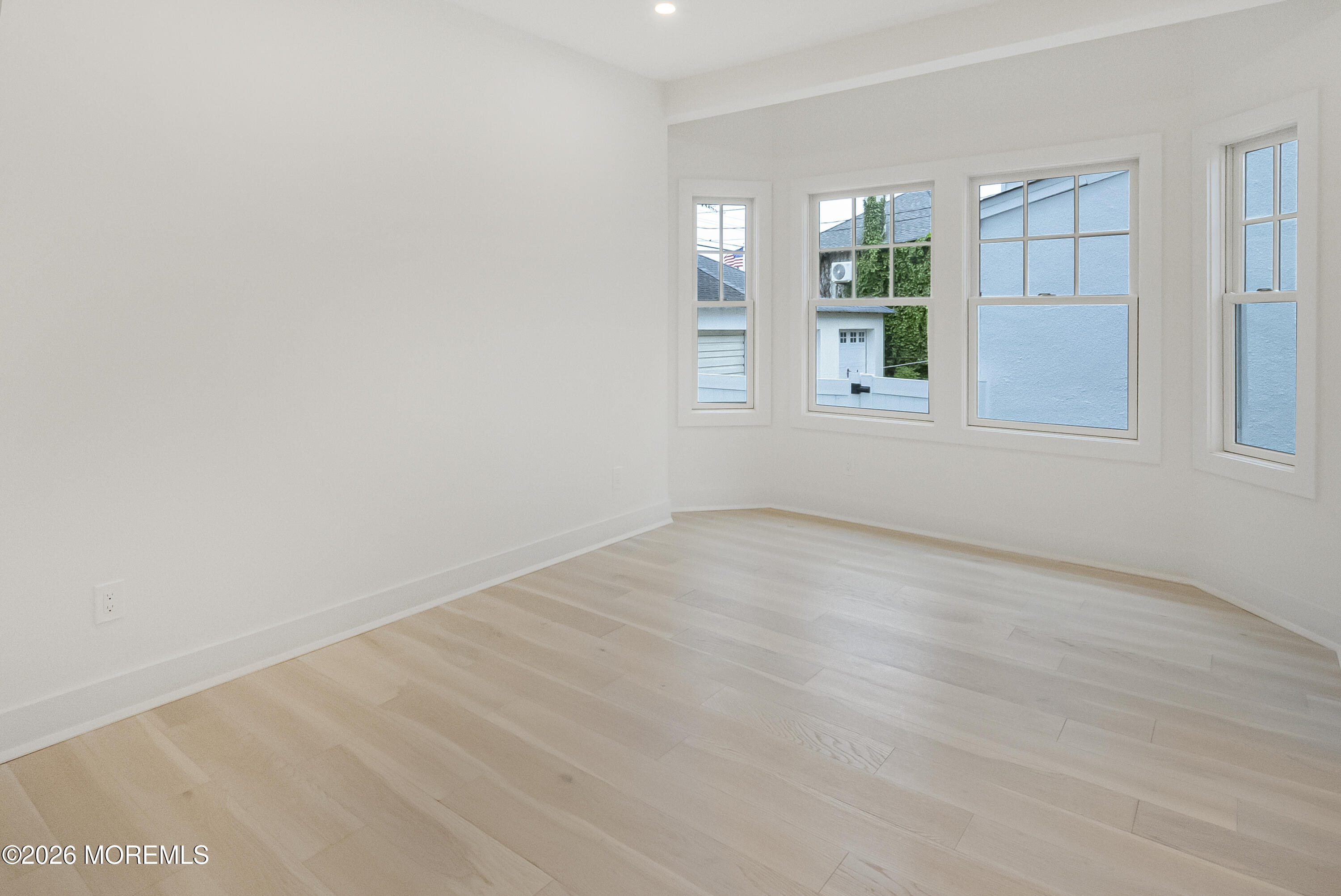 205 Edgemont Drive, Unit 1 Allenhurst, NJ 07711 - Photo 18 of 24 an empty room with windows