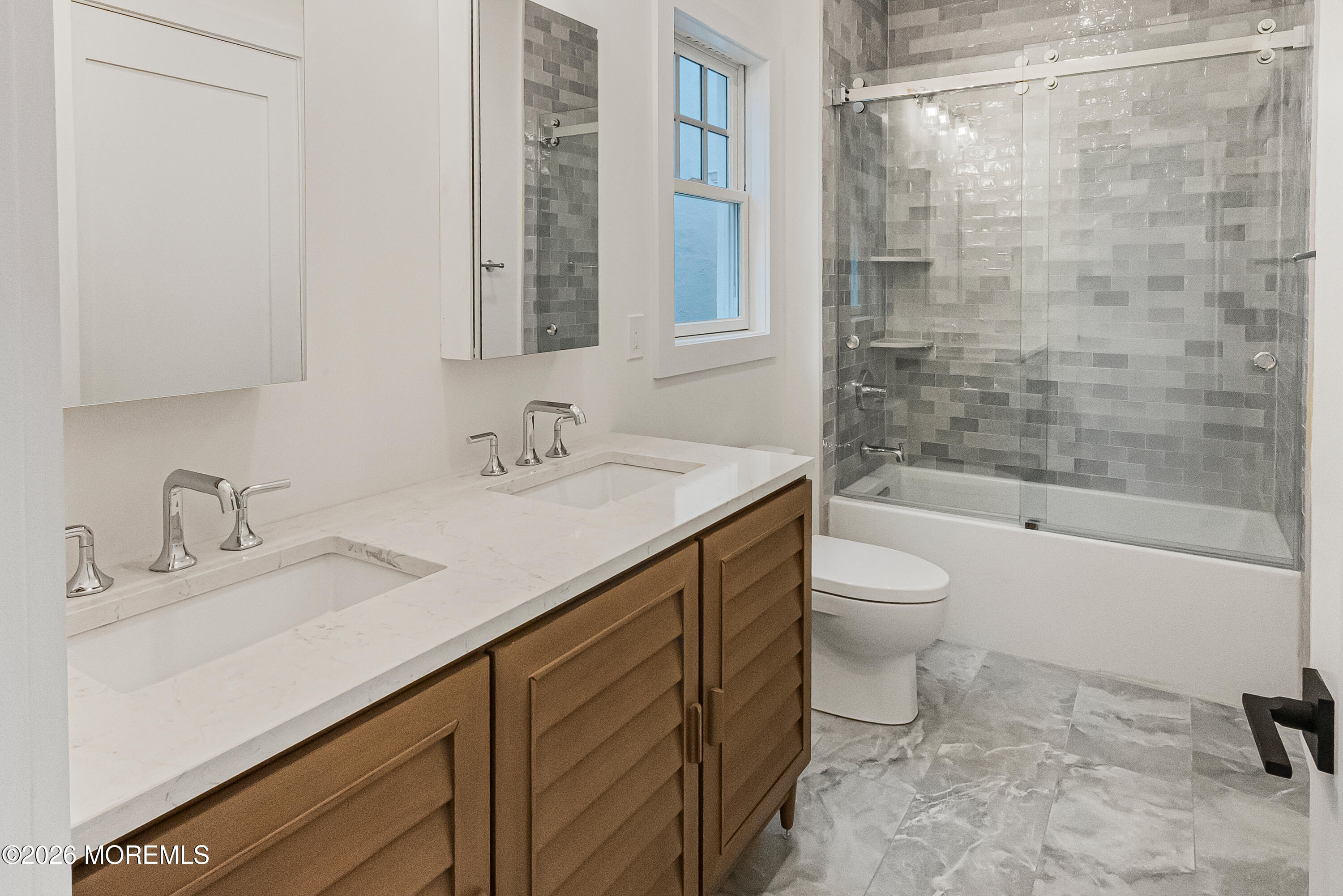 205 Edgemont Drive, Unit 1 Allenhurst, NJ 07711 - Photo 19 of 24 a bathroom with a sink and a mirror
