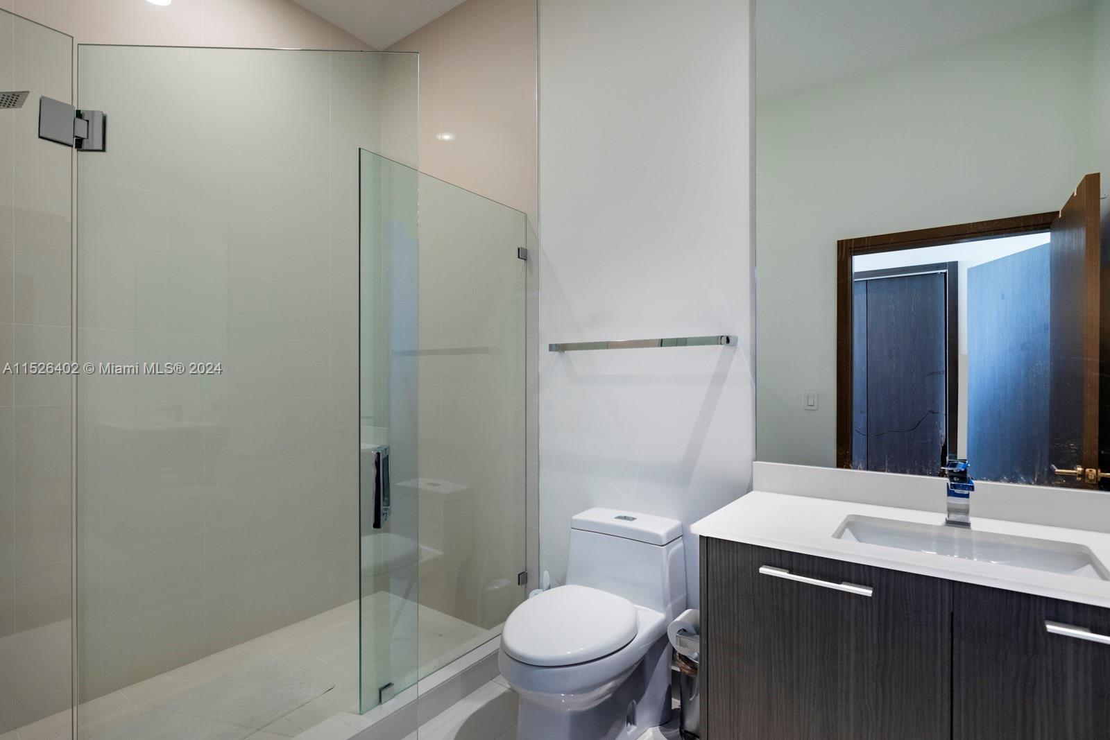 45 Southwest 9th Street, Unit PH4801 Miami, FL 33130 - Photo 22 of 41 a bathroom with a sink toilet and shower