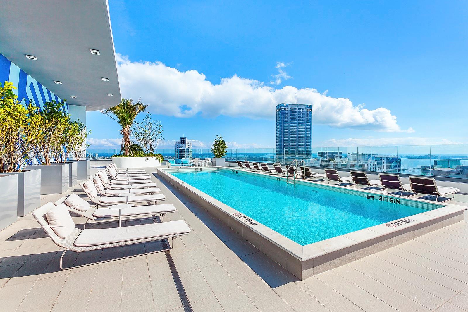 45 Southwest 9th Street, Unit PH4801 Miami, FL 33130 - Photo 5 of 41 a view of a swimming pool with a terrace