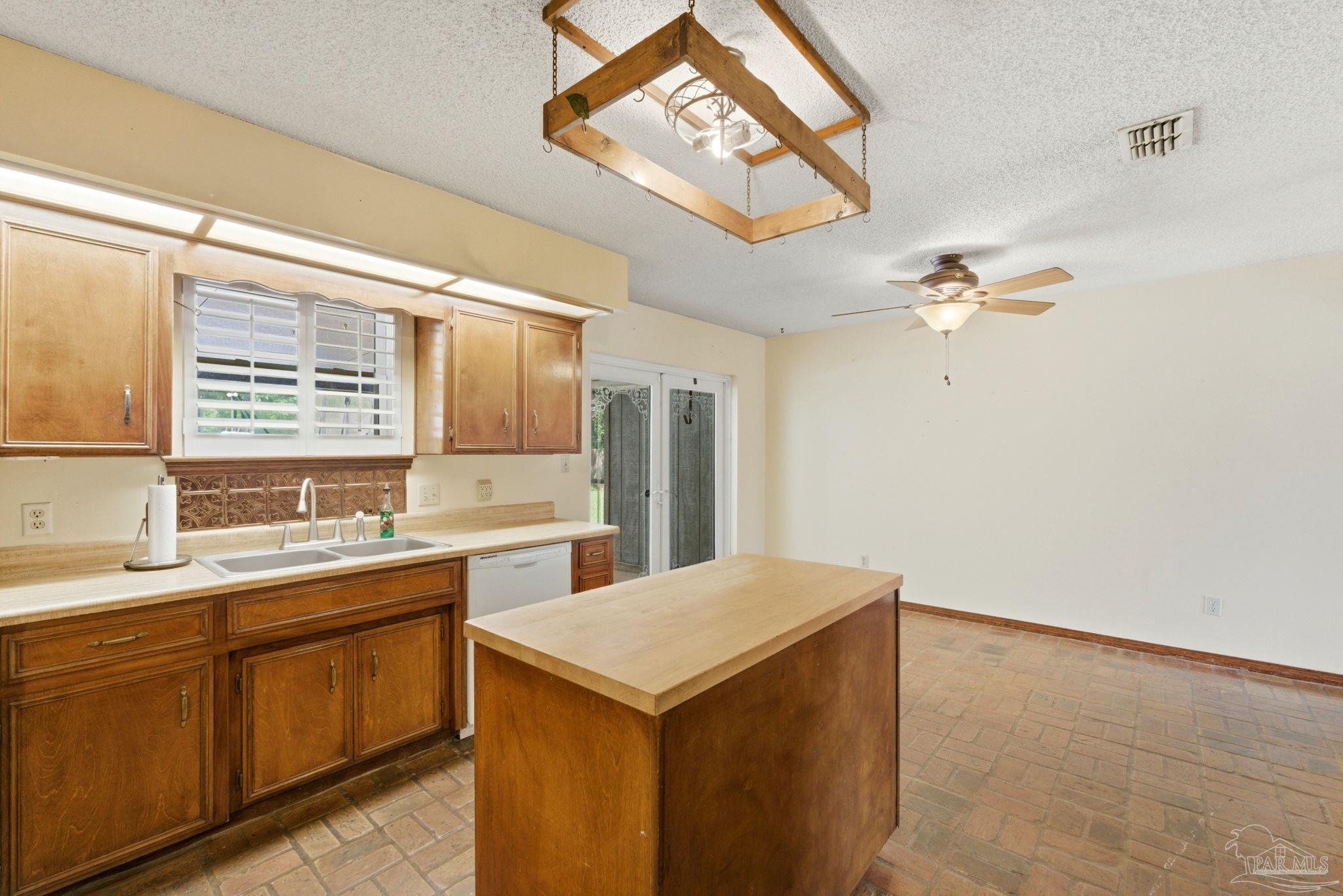 934 Springmier Place Pensacola, FL 32514 - Photo 13 of 49 a kitchen with a sink and cabinets