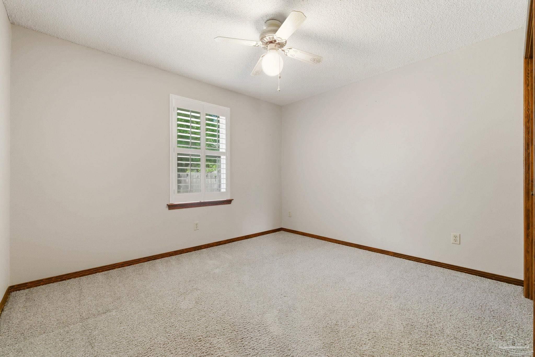 934 Springmier Place Pensacola, FL 32514 - Photo 16 of 49 an empty room with windows and fan