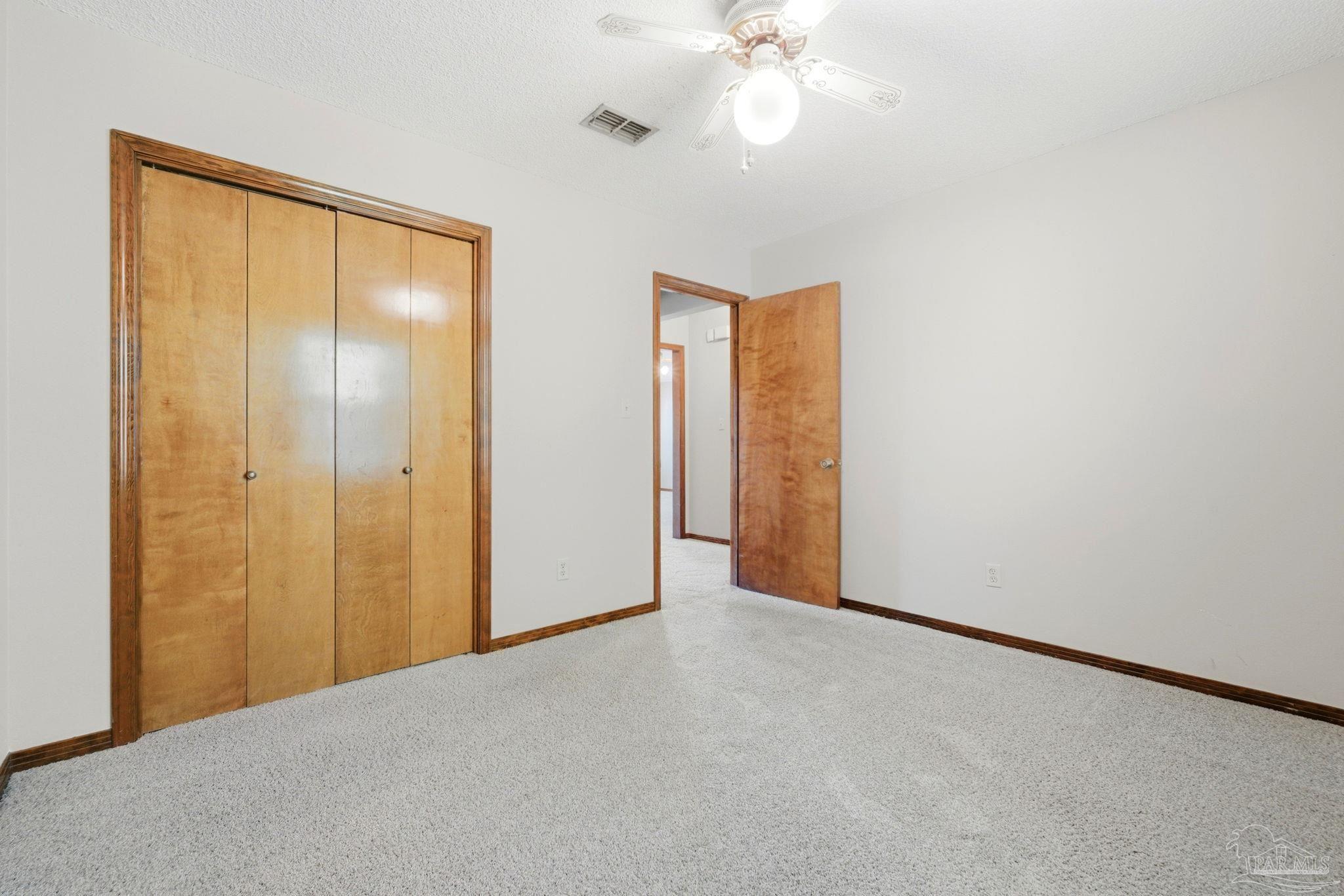 934 Springmier Place Pensacola, FL 32514 - Photo 17 of 49 a view of an empty room with a fan
