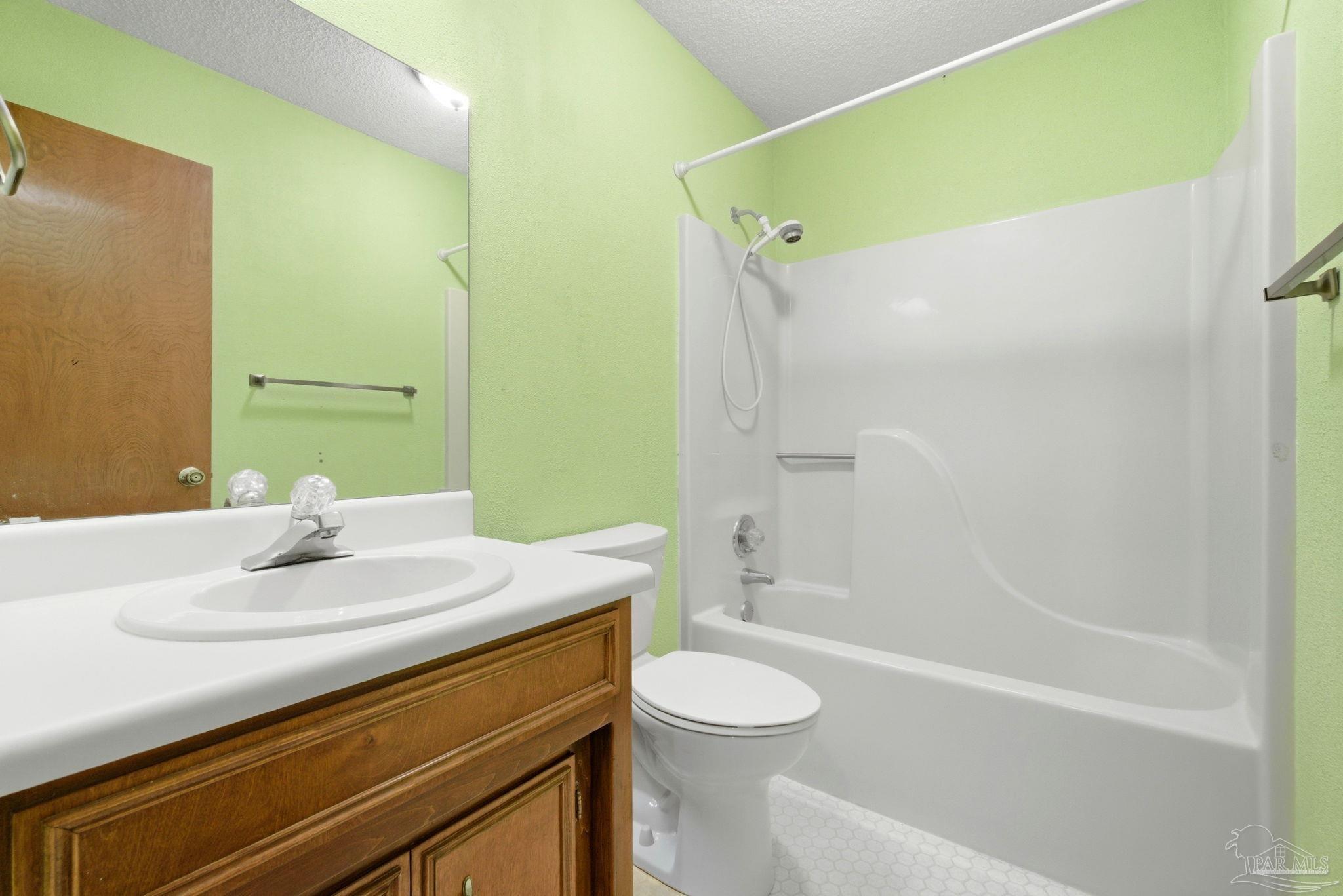 934 Springmier Place Pensacola, FL 32514 - Photo 18 of 49 a bathroom with a sink a toilet and shower