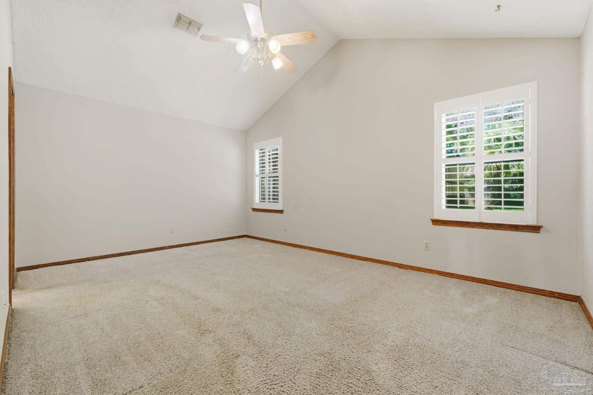 934 Springmier Place Pensacola, FL 32514 - Photo 19 of 49 an empty room with windows and fan