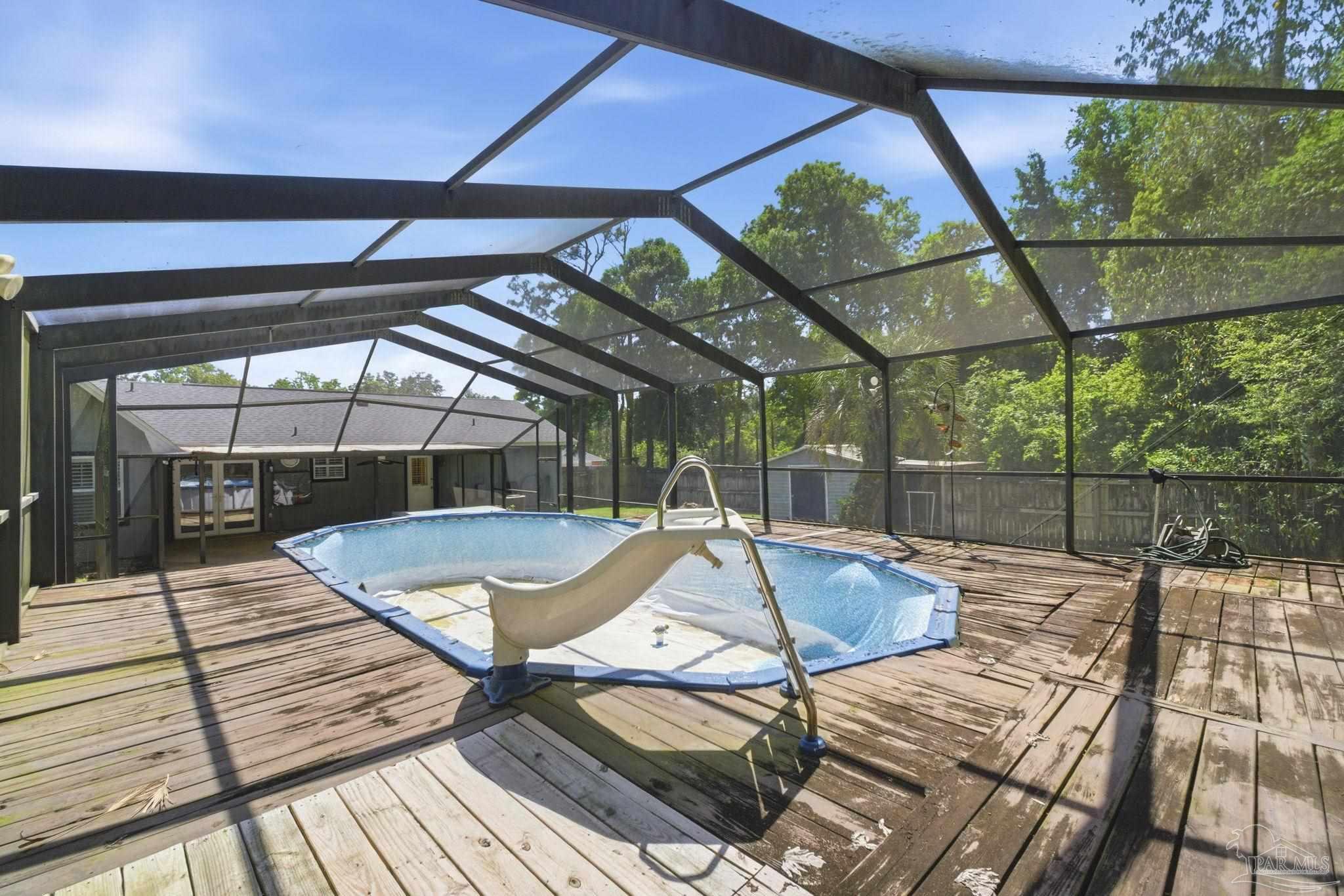 934 Springmier Place Pensacola, FL 32514 - Photo 32 of 49 a view of a swimming pool with a patio