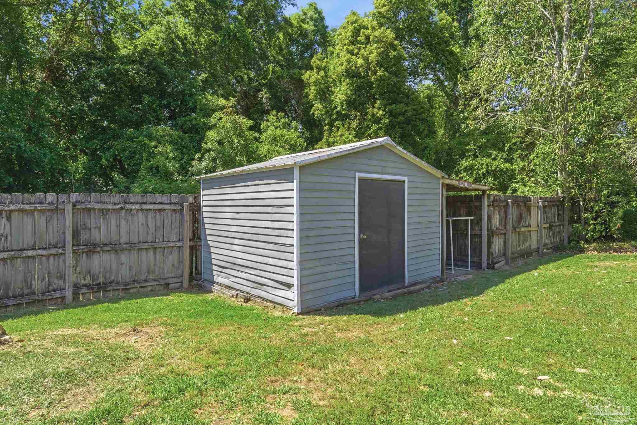 934 Springmier Place Pensacola, FL 32514 - Photo 45 of 49 a front view of a house with a garden