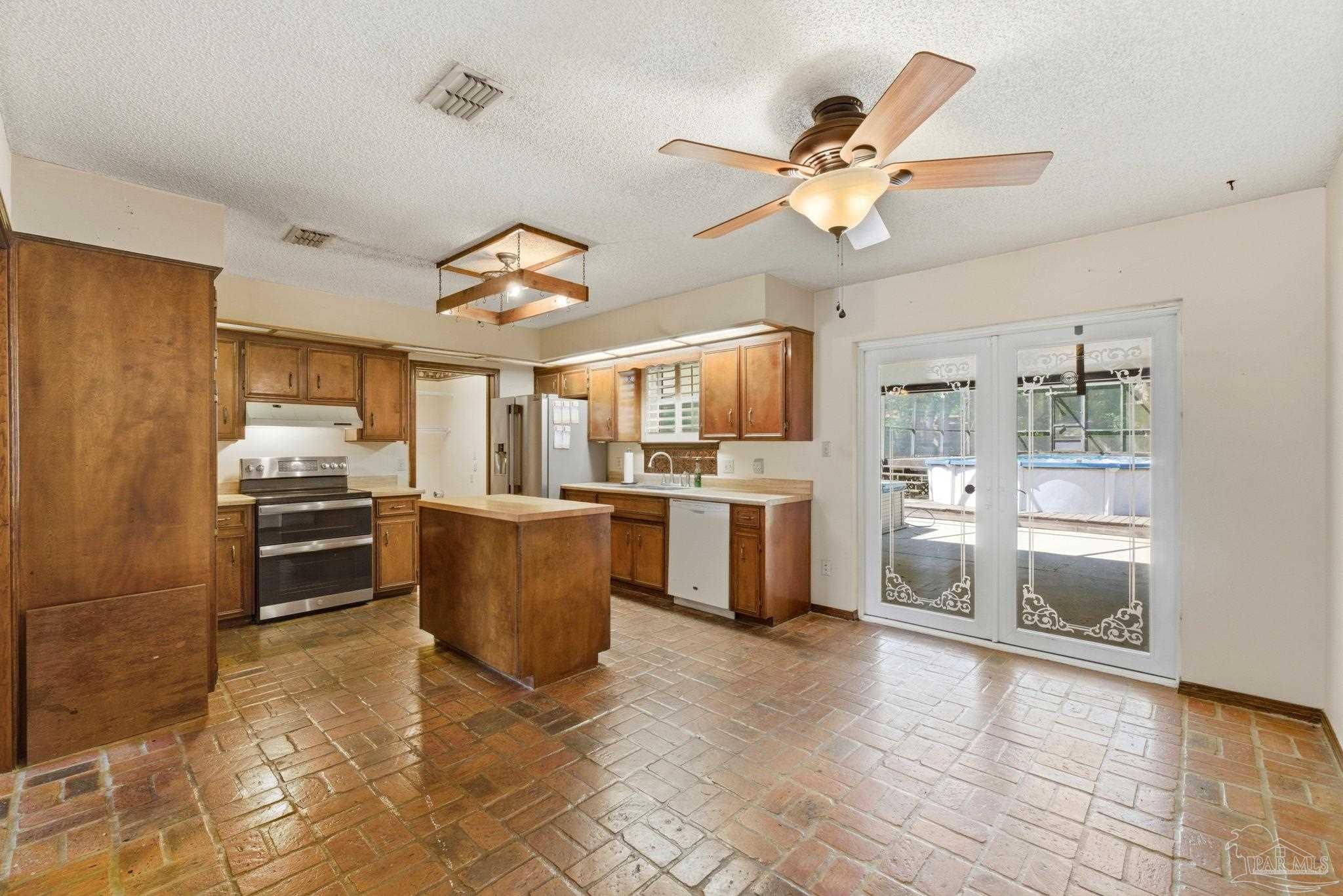 934 Springmier Place Pensacola, FL 32514 - Photo 6 of 49 a open kitchen with cabinets and stainless steel appliances