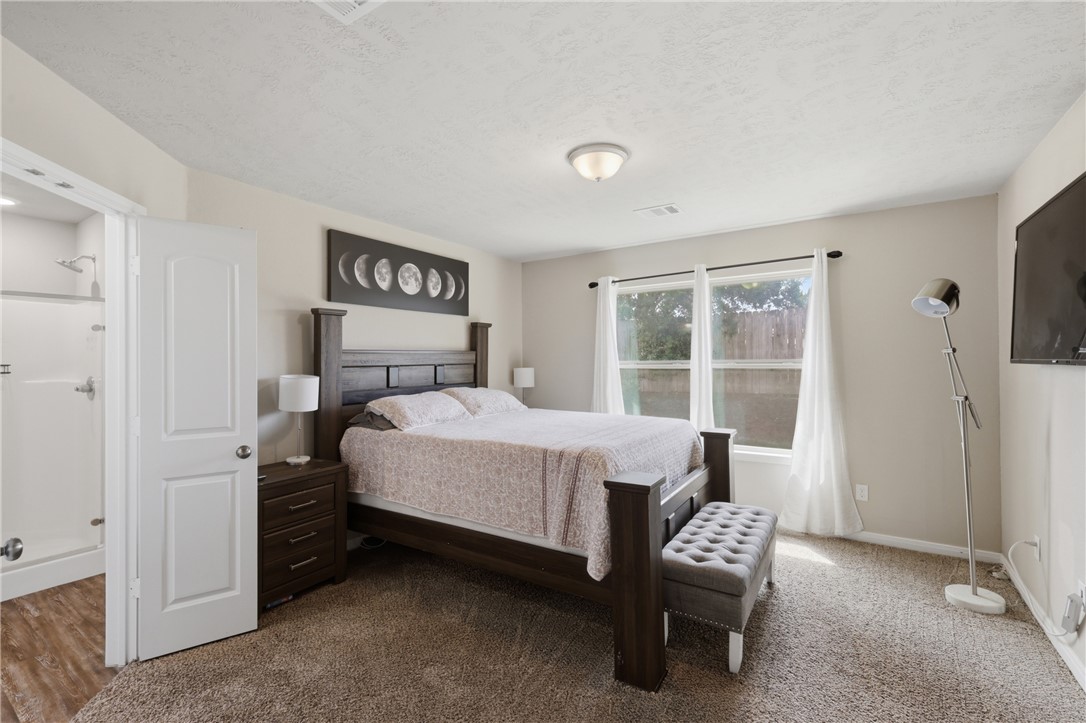 2725 Porter's Way Bryan, TX 77803 - Photo 11 of 19 a bed sitting in a bedroom next to a window