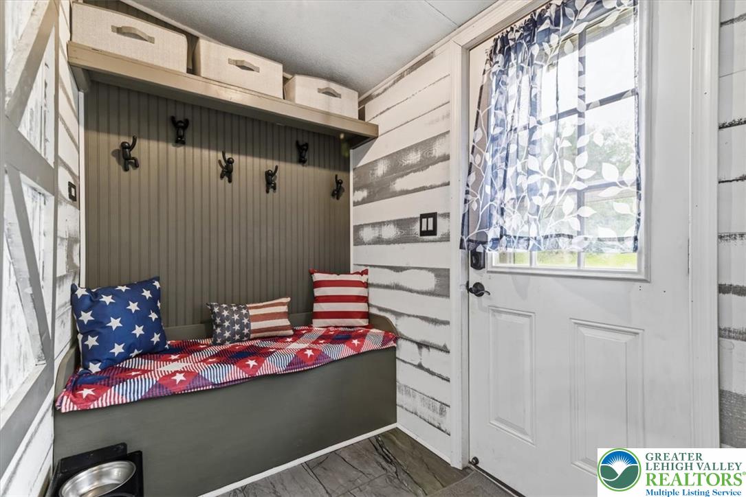 634 Main Road Lehighton, PA 18235 - Photo 7 of 39 A welcoming entryway offers a convenient bench with storage, perfect for daily arrivals.