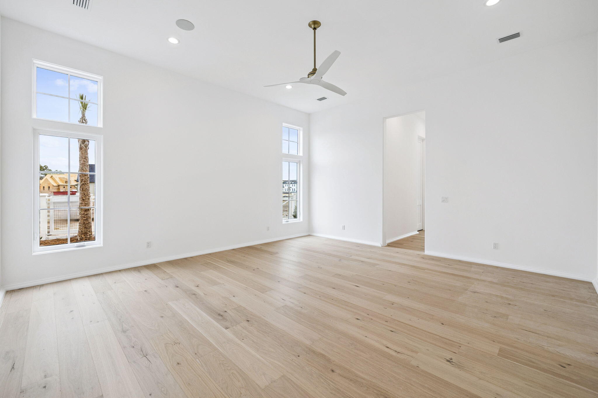 970 Windsong Dr Inlet Beach Inlet Beach, FL 32461 - Photo 28 of 78 a view of an empty room with wooden floor and a window