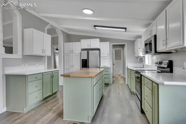 a kitchen with cabinets and a sink