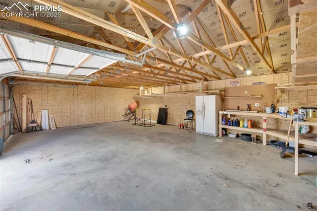 a view of a empty room with wooden ceiling