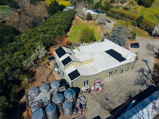 a view of a dining room with furniture wooden floor and a chandelier