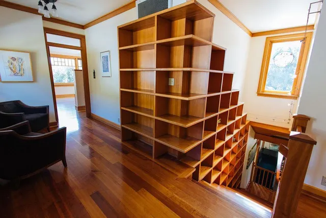 aerial view of a house with a garden and lake view