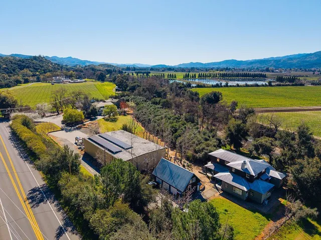 a view of a dining room with furniture wooden floor and a window