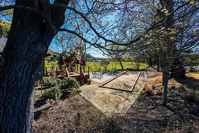 a view of swimming pool with a table and chairs