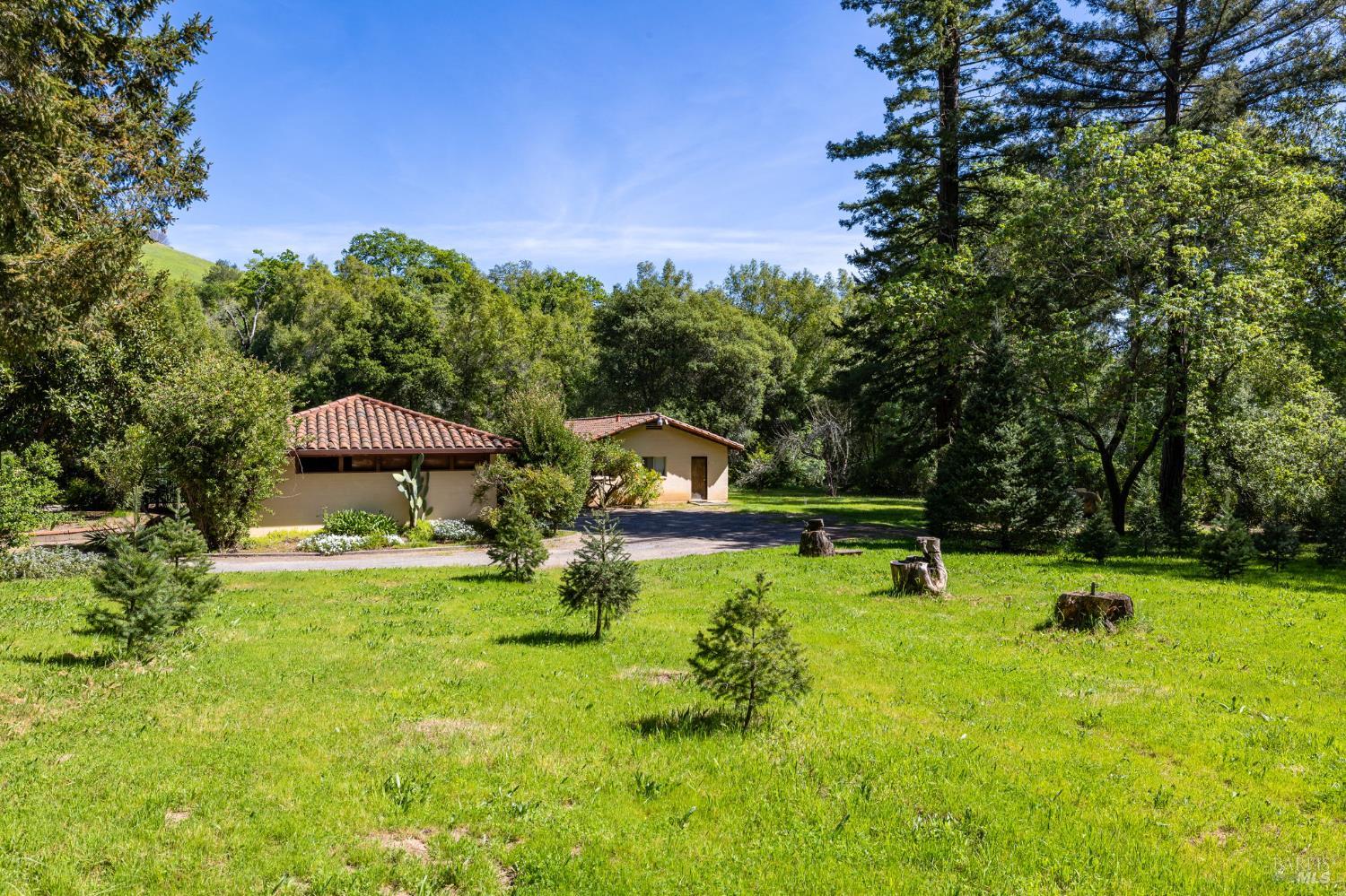 3320 Redwood Road Napa, CA 94558 - Photo 25 of 57 a view of a garden with a slide and a lake view