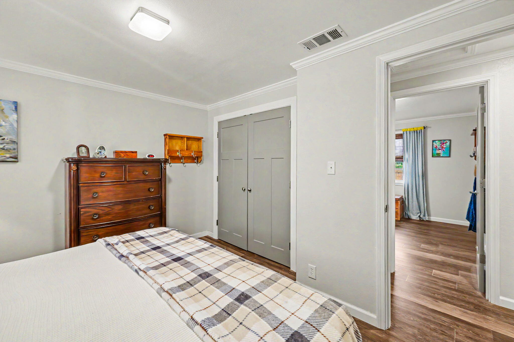 145 Highway 234 Eagle Point, OR 97524 - Photo 20 of 43 a bedroom with a bed and wooden floor