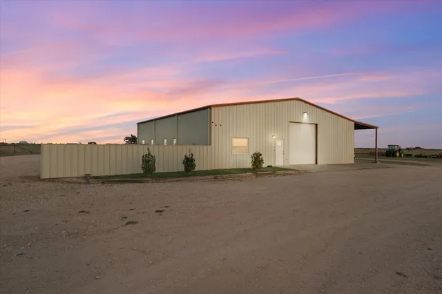 a view of a house with a road