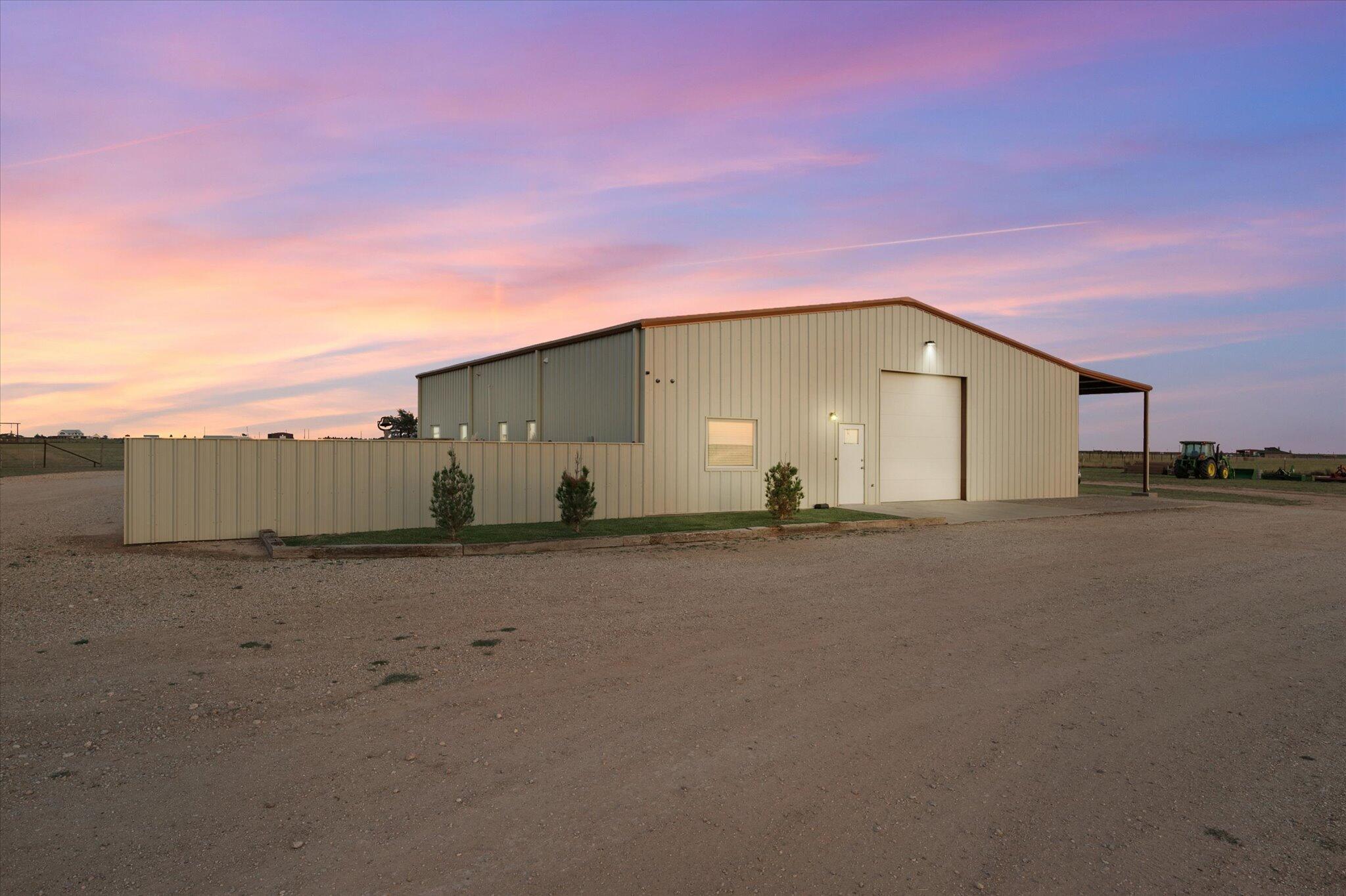 a view of a house with a road