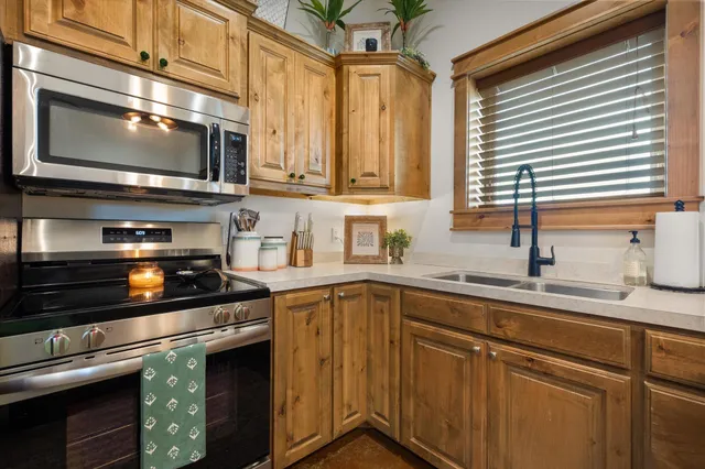 a spacious bathroom with a double vanity sink and a mirror