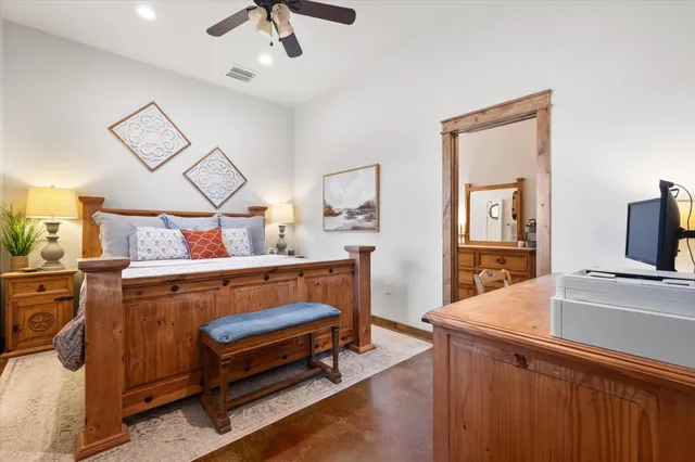 a bedroom with a bed and a couch