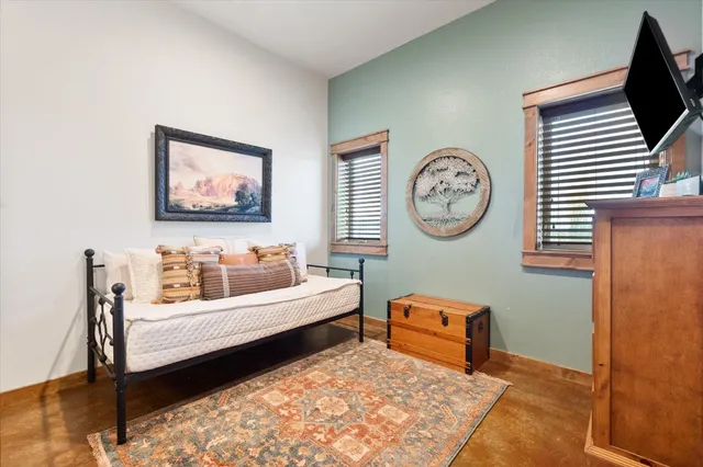 a bedroom with a bed and furniture